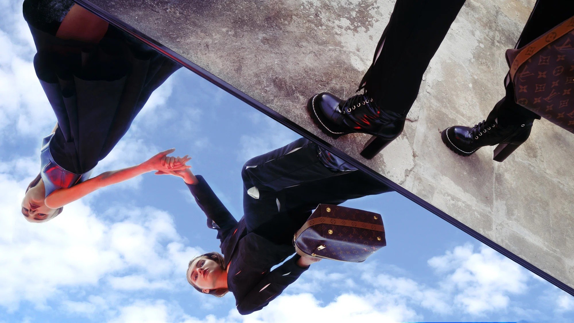 Figures and shoes reflected in an overhead mirror