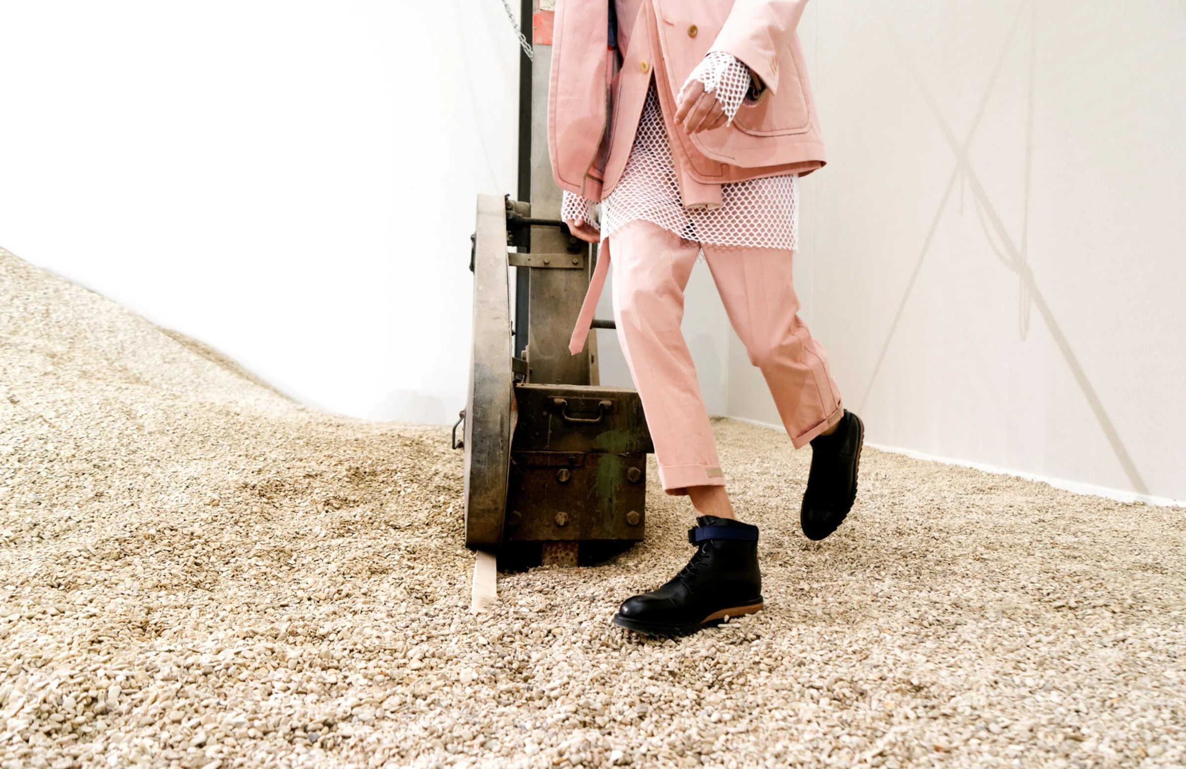 Detail of a pale pink outfit in motion