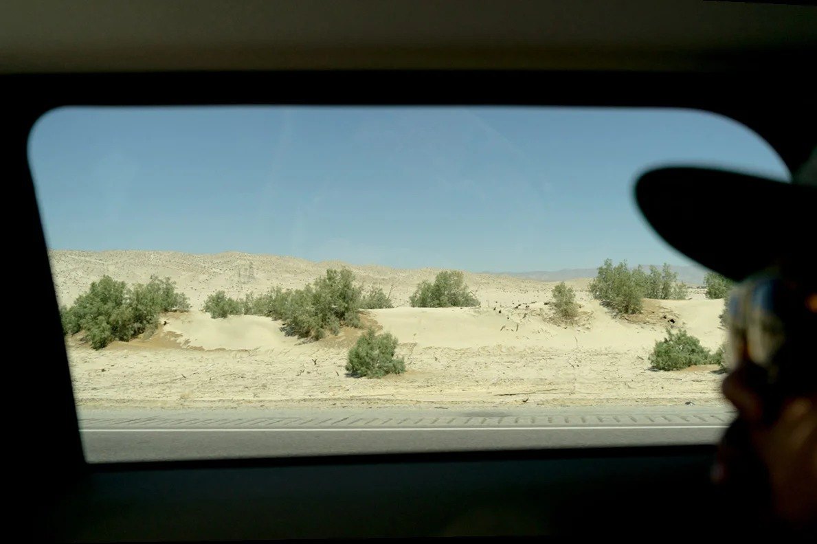 Desert landscape seen through a vehicle window