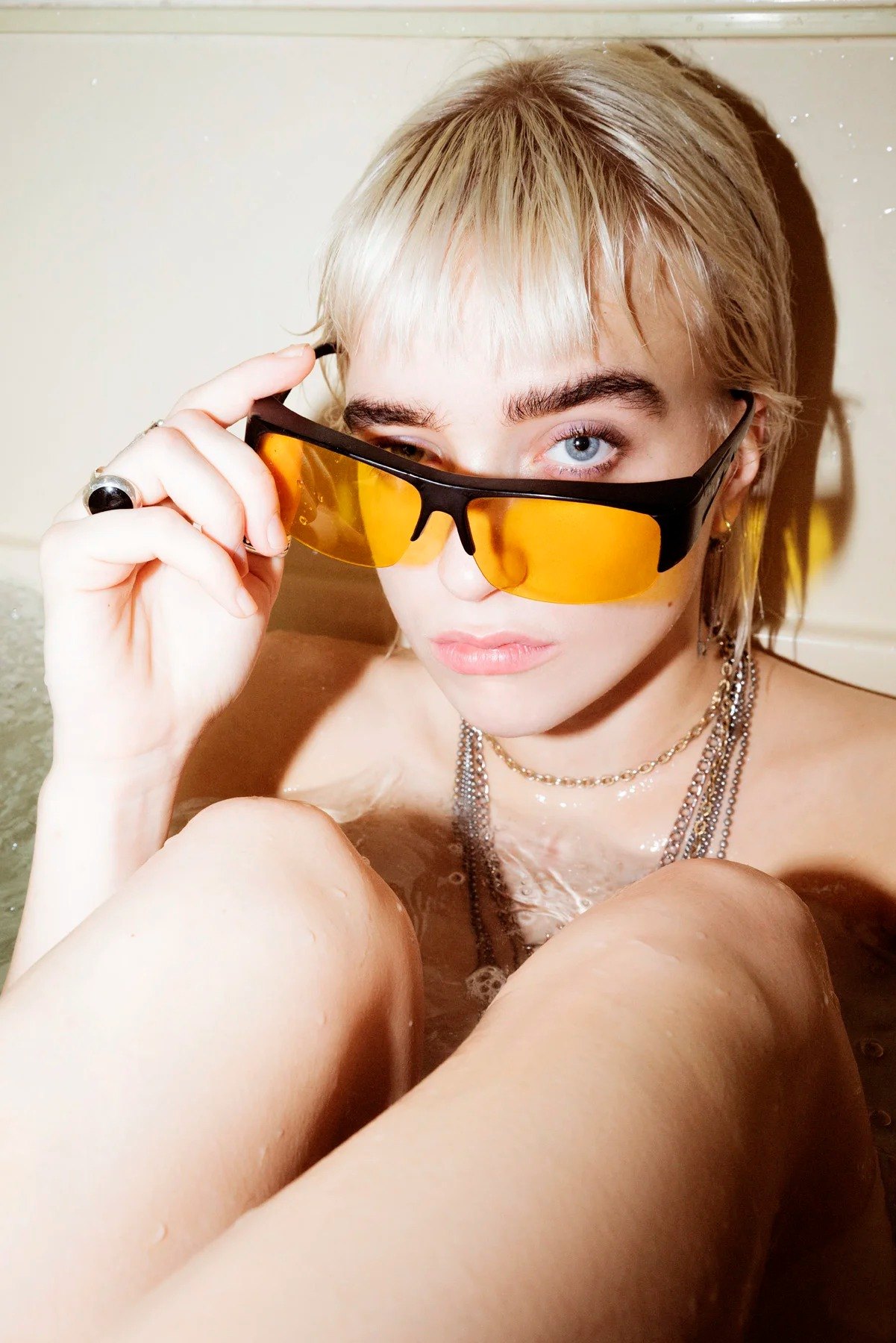 Sonya looking over yellow-tinted sunglasses