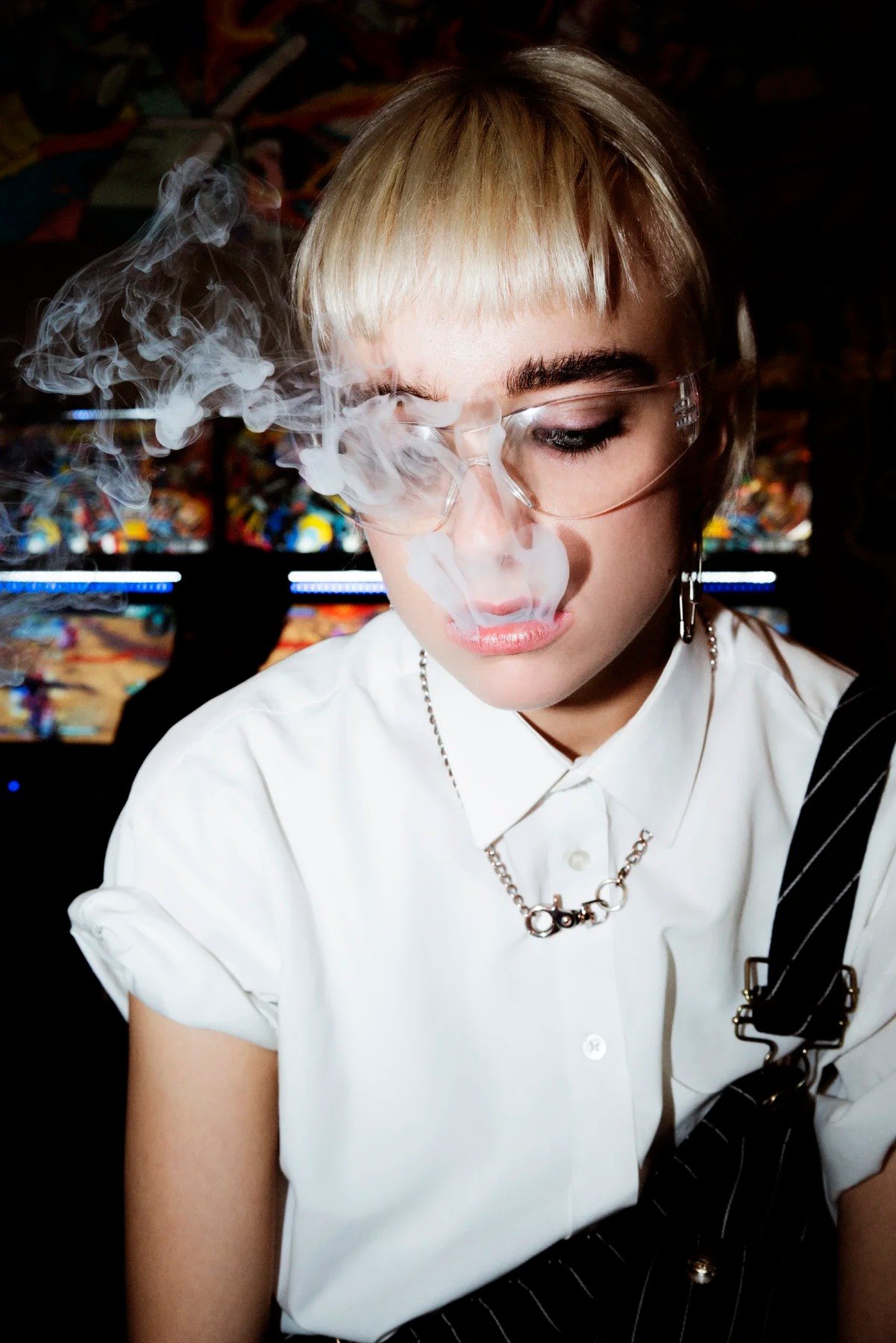 Portrait of Sonya in a white shirt with eyes lowered